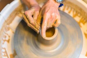 Pottering - creating a clay cup in process photo