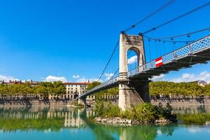 Old Passerelle du College bridge over Rhone river in Lyon, France photo