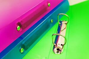 three multicolored folders photo