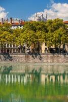 Cityscape of Lyon, France with reflections in the water photo