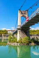 Old Passerelle du College bridge over Rhone river in Lyon, France photo