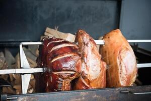 roasted pig knuckle on the spit photo