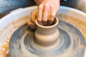 Pottering - creating a clay cup in process photo