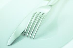 Fork and knife on a white background photo