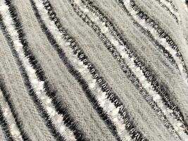 Grey White And Black Fur Fabric Background photo