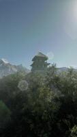 A picture of a mountain with a house in the foreground video