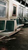 Empty seats in a metro train car with a blackboard on the wall video