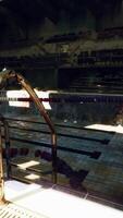 An abandoned swimming pool in a dilapidated building video