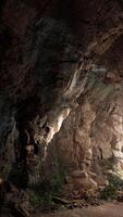 A mysterious tunnel with rays of light piercing through the darkness video