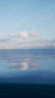 A serene landscape with a reflection of the sky on the water surface video