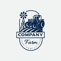 Farm logo design with tractor and windmill vector