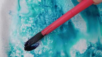 Artistic flow vibrant brush strokes creating abstract patterns with fluid dynamics and colorful movements on canvas. video