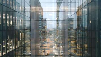 Aerial view of Windows in a high-rise office building early morning with interior lights glowing. Corporate offices.Night view Skyscraper with night lights and empty offices video