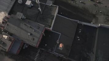 man stand and prepare fix rooftop on old soviet building video