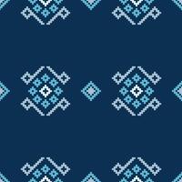 Ethnic pattern pixel motif cross stitch with blue color background fabric pattern art. vector