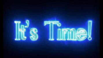 Bright neon text saying It's Time glowing in vibrant blue on a dark background, creating a bold and dynamic visual effect video