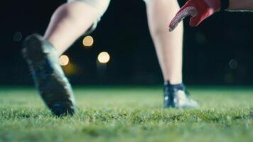 Cinematic shot of American Football player Kickoff Game Start. Static Close-up of Ball Being Kicked by the Professional Player. Gates Goal Kick. Successful Team Scores and Wins Championship. video