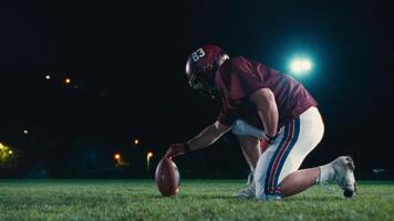 Cinematic shot of American Football player Kickoff Game Start. Static Close-up of Ball Being Kicked by the Professional Player. Gates Goal Kick. Successful Team Scores and Wins Championship. video
