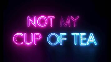 Vibrant neon sign reading NOT MY CUP OF TEA in pink and blue glowing letters, set against a dark background, creating a modern and playful visual video
