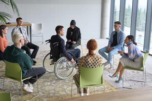 Corporate business team meeting with a manager or coach. Group of happy diverse, multiracial people sitting in a circle photo