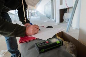A close-up of an engineer's hand meticulously sketching an architectural project, capturing the precision, creativity, and focus involved in bringing innovative designs to life photo