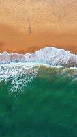 Overhead view of waves crashing on sandy seashore at beach video