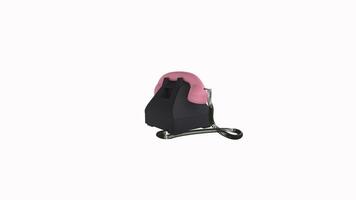 Retro rotary phone in black and pink design on display video