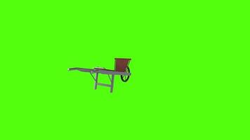 Wheelbarrow displayed against a bright green background video