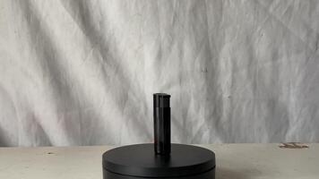 a black lighter object on a table video