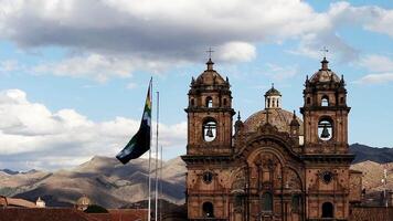 Cusco Flag Flying On Flagpole With Church And Bell Towers Hills Sky And Clouds Peru South America video