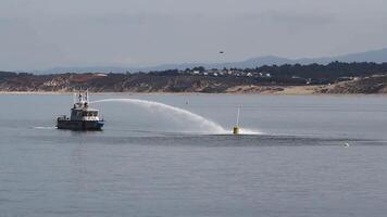 Monterey, CA, 2016 - Fire Boat Practicing Using Water Canon Aimed At Buoy Monterey Bay California video