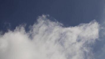 White Cumulus Clouds Slowly Moving Down With Blue Sky At Top Of Frame video