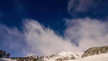 Clouds are flying over the Swiss Alps, Grisons, Switzerland, time-lapse video