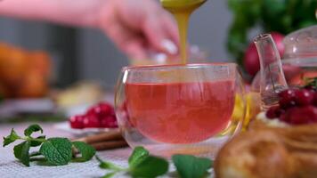 add honey to raspberry tea Honey and coconut powder are added to the chia seeds in the milk video