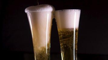 foam flows out of a glass of beer pouring beer into pint in motion. Filmed on high speed cinema camera. Camera placed on high speed cine bot. Speed ramp effect. video