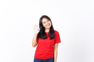 Smile looking at Camera and say Hi or Hello Of Beautiful Asian Woman wearing red Isolated On White Background photo