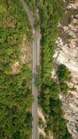 Aerial view of car driving on mountain road. video
