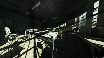 Empty classroom with sunlight streaming through abandoned desks video