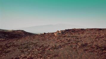 Vast landscape view from a hilltop under a clear sky, during daylight hours video