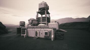 Exploratory colonist base situated on a remote planets surface during twilight video