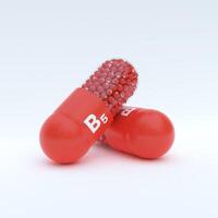 Vitamin B5 With Red Capsule, Granules and White Background photo