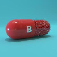 Vitamin B With Red Capsule, Granules and Turqoise Background photo