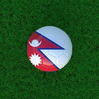 Flag of Nepal on a Soccer Ball with a Grass Background photo