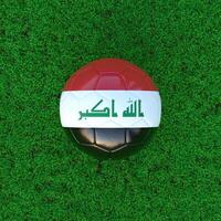 Flag Of Iraq On Soccer Ball With Grass Background photo