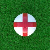 Flag Of England On Soccer Ball With Grass Background photo