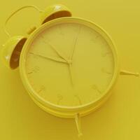 Yellow Analog Clock with Yellow Background photo