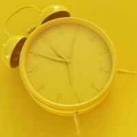 Yellow Analog Clock with Yellow Background photo
