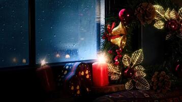 Christmas New Year Eve Decoration and Gift Boxes on a Candle Light Near the Window Glass in Rainy Day photo