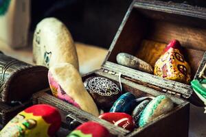 Colorful Painted Handmade Stones in Case photo