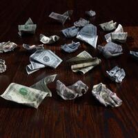 Crumpled Dollars On A Table photo